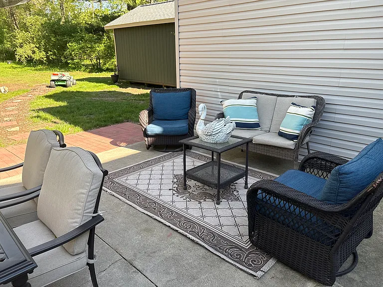 The back patio is great for entertaining or relaxing with the family. Patio furniture not included.