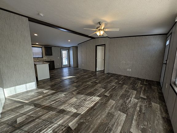 View of Living Room from entry to right, Rear door to back deck.