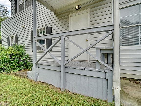 Entrance to upstairs Apartments #3 and #4 is on the side.