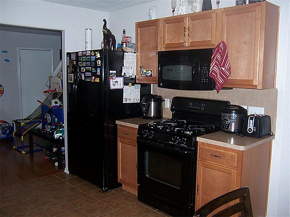 Right View - Sleek Black Appliances in your Kitchen.