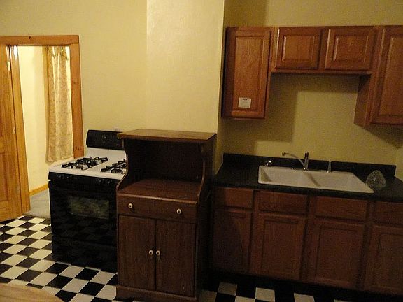 Kitchen with gas stove.