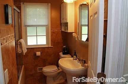Rip & replace (2011) Upper Bath
						:
						Rich, tiled with new tub and vanity, sink, toilet.