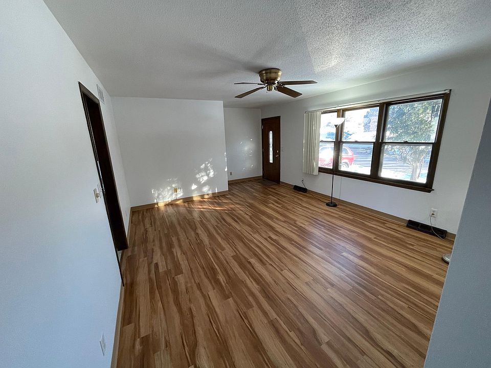 Large windows light up the living room.