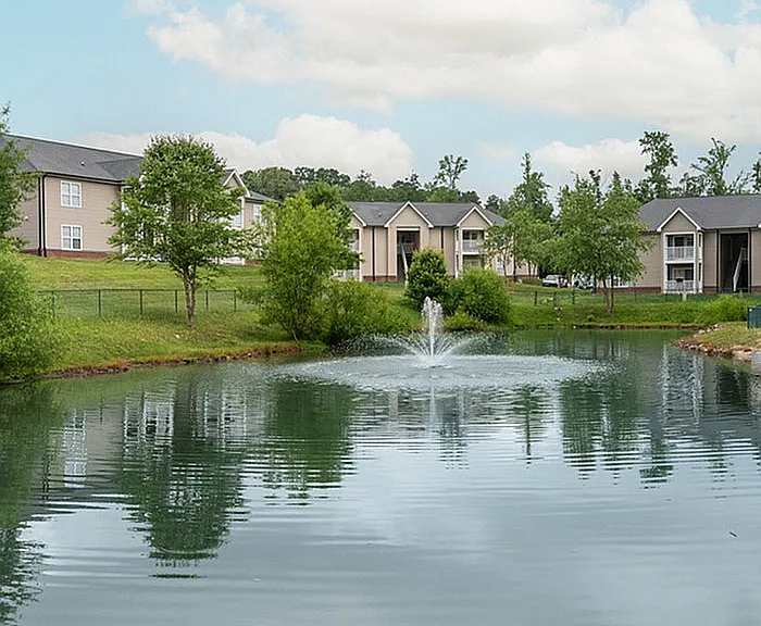 Experience peaceful living with a stunning view of the fountain and landscaped surroundings.