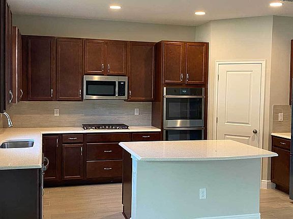 Saratoga new home kitchen view with large walk in corner pantry William Ryan Homes Tampa