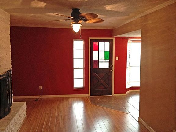 Another view of the family room showing off the updated ceiling fan and views ov the lake.