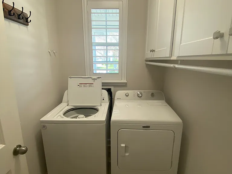 Laundry Room, washer, dryer, and cabinet storage