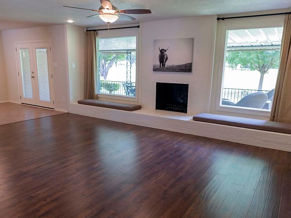 Open Concept living with view of golf course with wood burning fireplace