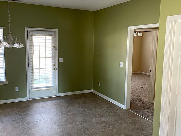 Another view of kitchen, back door and master door.
