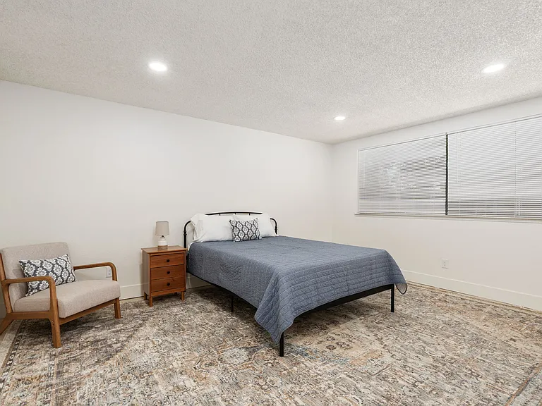 Bedroom 3. Step down. Large area 12'x15'. Queen size bed.