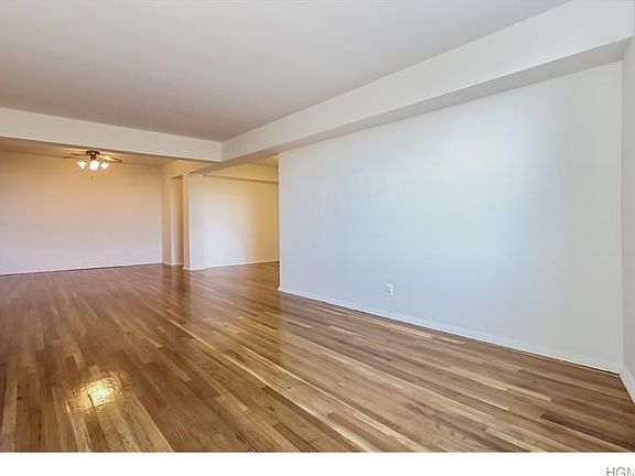 Here is the 11 x 34 living room as viewed from the opposite end. Did you notice the lovely refinished hardwood floors?