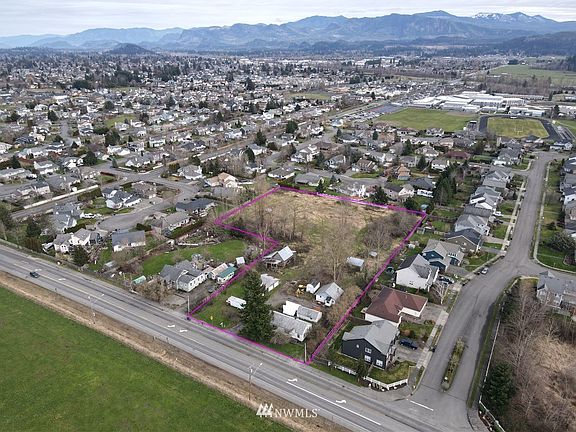 Cascade range in background. Property outlined in red. Housing developments are either side with sewer.  >