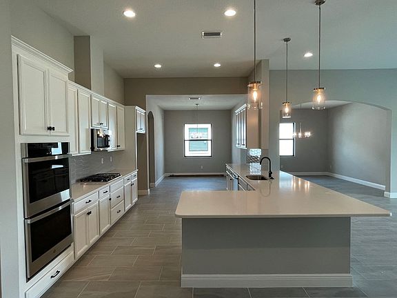 Sweet bay new construction quick move-in home plan designer gourmet kitchen at Cross Creek by Willia