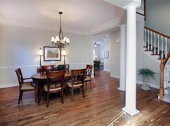 Rich molding, flooring, columns and handsome staircase.