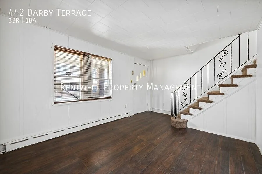Updated 3-Bedroom End-Unit Home with Covered Porch & Patio — Photo 4