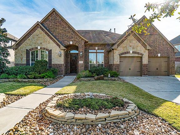 This Trendmaker stone & brick beauty has all the bells and whistles - from the 3-car garage with epoxy-coated floor, workbench, side door access to the backyard to the whole-house Generac generator system! All of this topped off with wonderful curb a