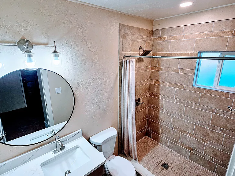 Brand new bathroom added on during remodel. Connected to large living space/possible 3rd bedroom