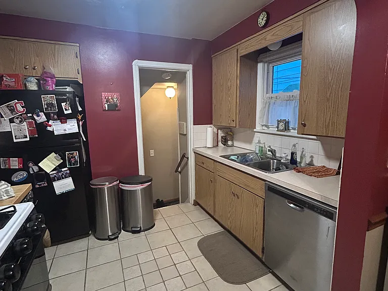 Kitchen (doorway leads to side door outside and also stairs down to basement)
