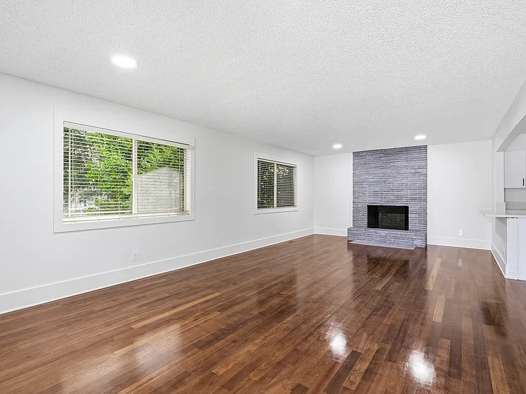 main floor living room with fireplace and open concept