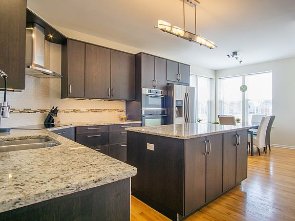 Gleaming hardwood floors, custom back splash and new lighting, pantry closet off kitchen
