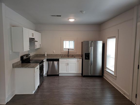 Just inside the front door, the open concept kitchen/living/dining rooms welcome you in!