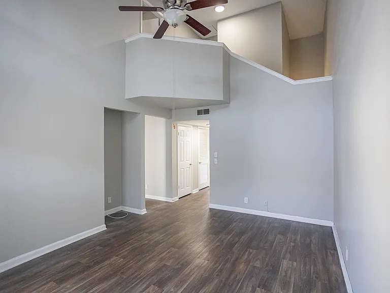 Spacious living room with hardwood-style flooring