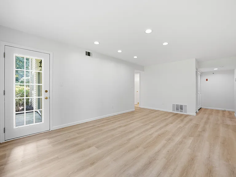 Living room with walk out door leading to patio