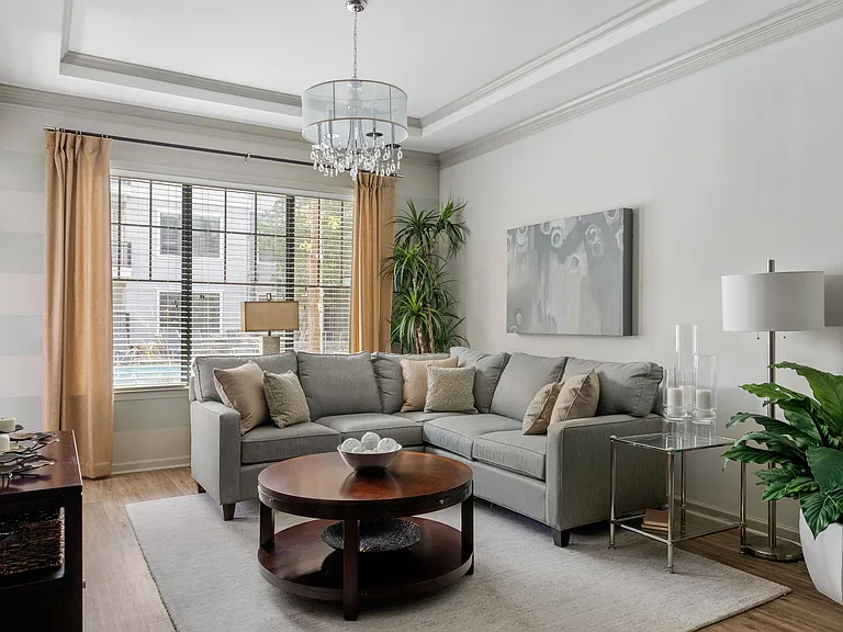 Step into this elegantly designed living room, where comfort meets chic modernity.