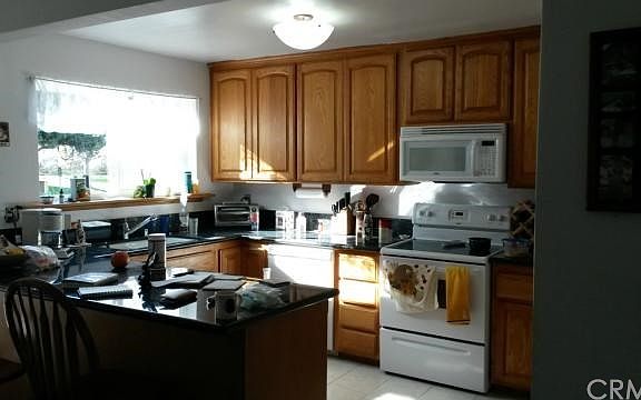 Kitchen with granite counter tops and newer cabinets
