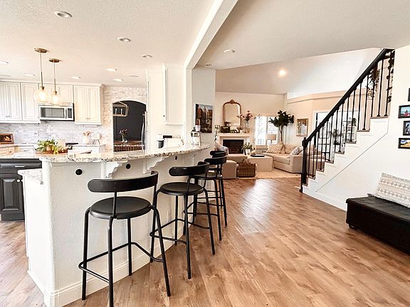 View from the wet bar area of the kitchen and living room.