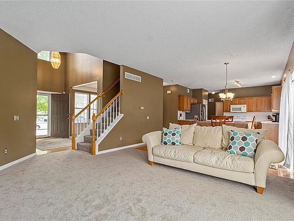 Open concept plan with spacious Family Room and Kitchen. Perfect for entertaining. New carpet and interior paint.