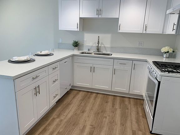 New gas stove and breakfast bar compliment this upgraded kitchen
