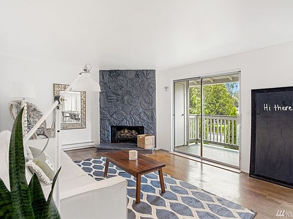 Spacious living room, with wood burning fireplace for staying cozy in the winter