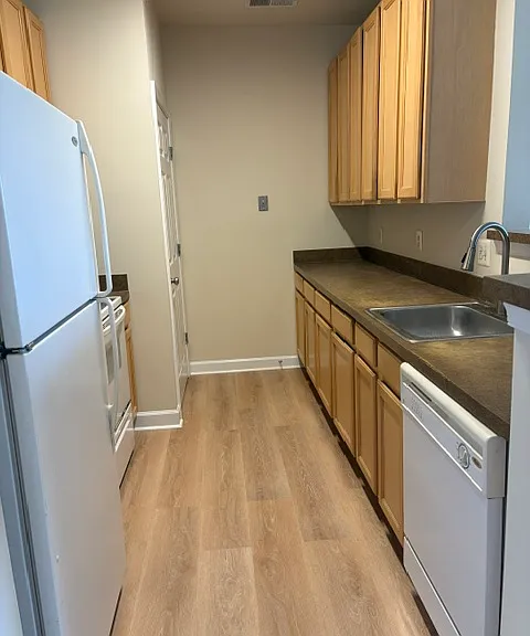Kitchen. Full size washer and dryer in the laundry closet