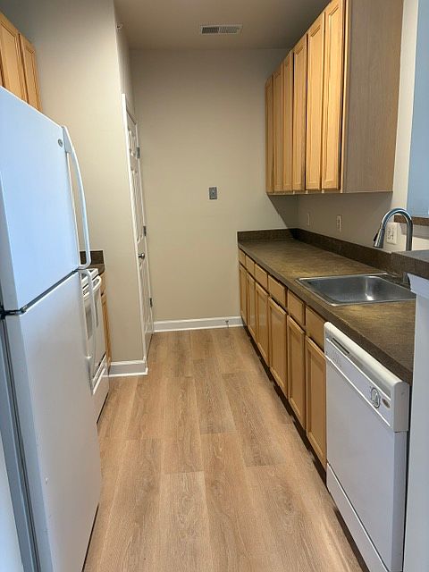 Kitchen. Full size washer and dryer in the laundry closet