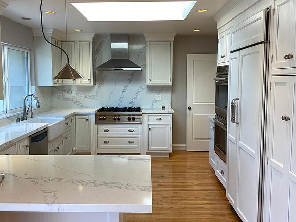 Bright Kitchen with Wolf Range, Double Oven, and Sub-Zero Frig