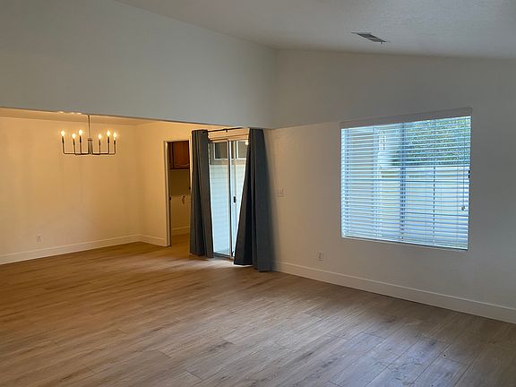 from dining room area sliding glass doors open to enclosed patio area