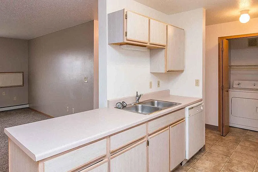 EAST WOODS APARTMENTS — Photo 2