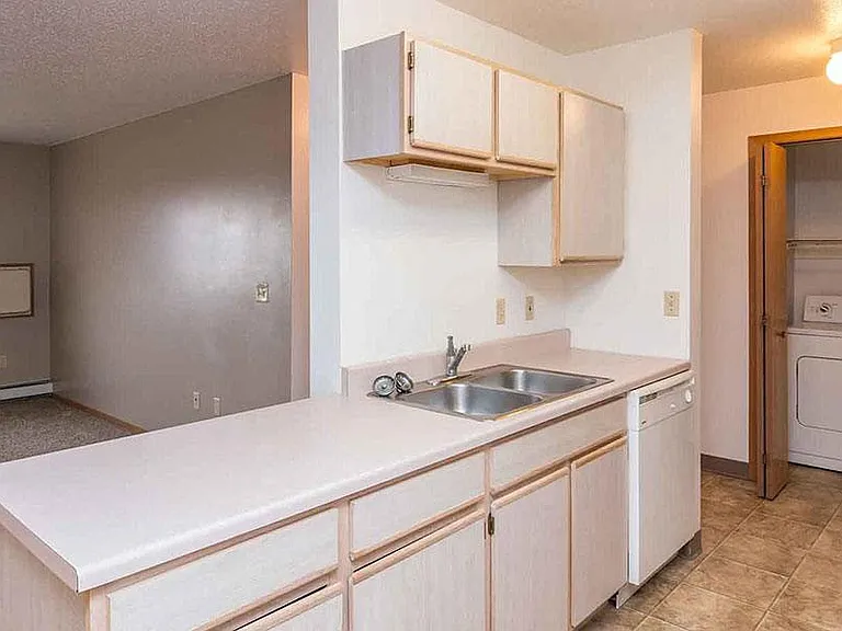 EAST WOODS APARTMENTS — Photo 2