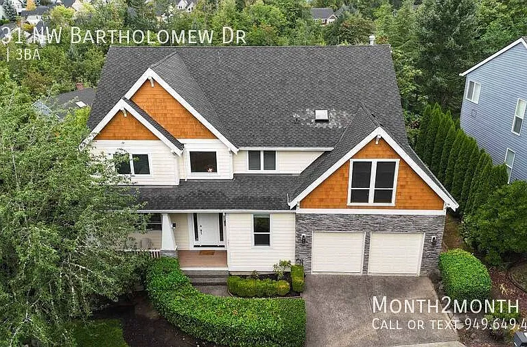 9831 NW Bartholomew Dr — Photo 39