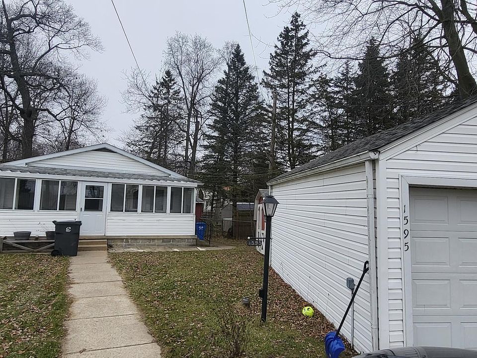 All weather front porch and 2 car detached garage