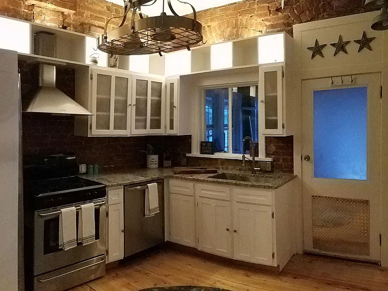 Fully remodeled kitchen with granite countertops, deep over-sized sink with industrial faucet