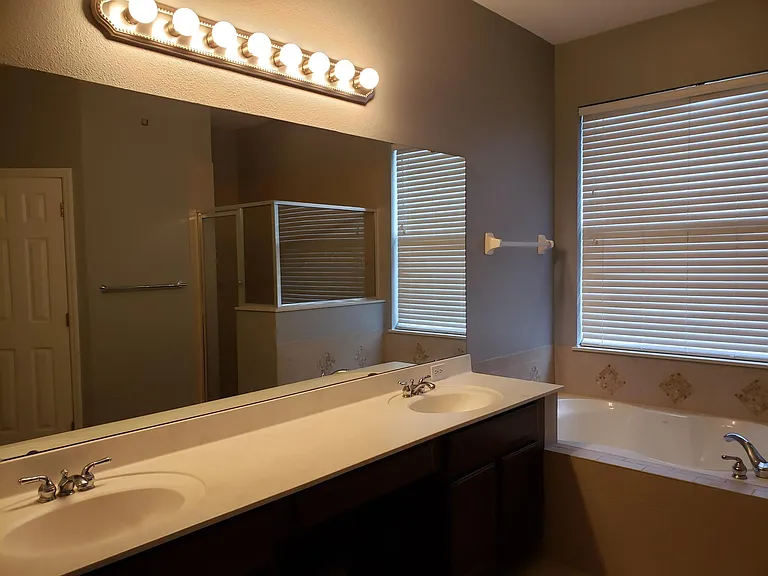 Master bathroom with double sinks, garden tub and separate shower stall.