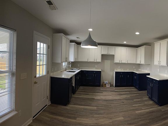 View of Kitchen from Living area. Newly remodeled. All new appliances. Door to screened porch and fenced backyard.