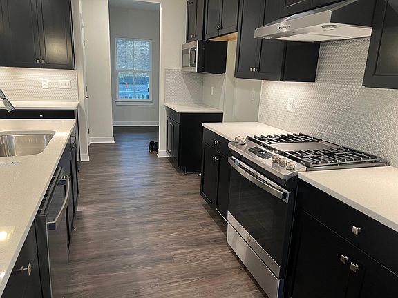 stainless Steel Appliances with back splash and under counter lights