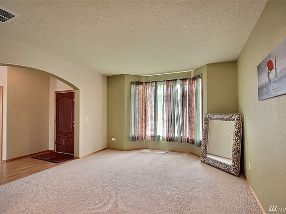 You have to love the curved archways in this home!