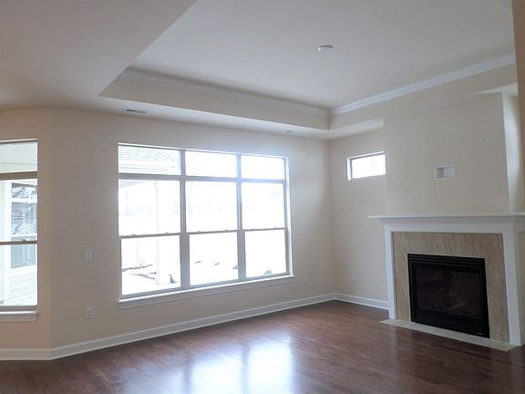 Great Room with lots of natural light, hardwood floors and fireplace