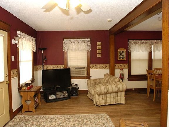 Family room with ceiling fan and hardwood floors