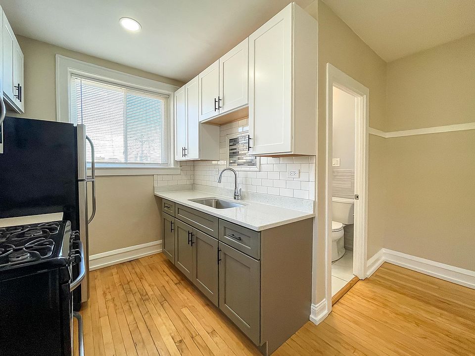 New cabinets, sink, faucet, tile and solid surface countertop