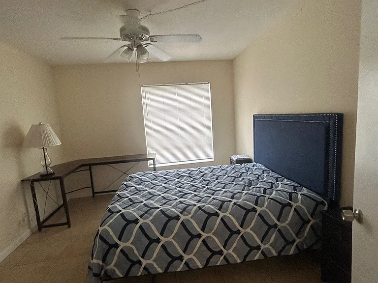queen size bed with two nightstands and dresser